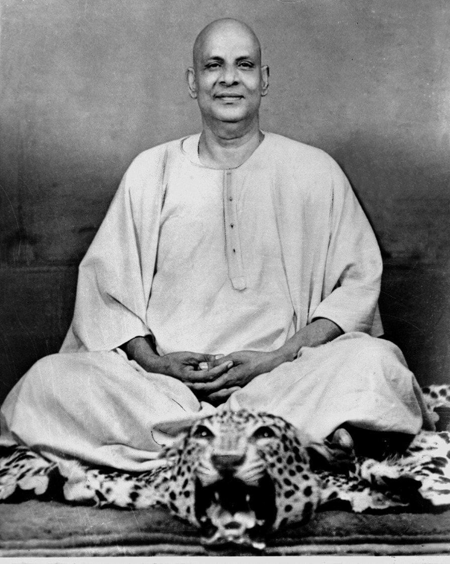 sivananda seated on leopard skin