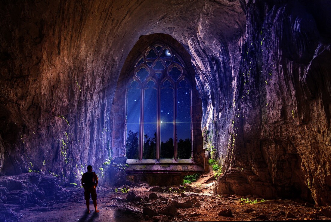 Church door inside a cave with moonlight pouring in with a silhouette of a man