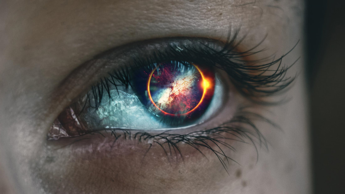 moon and sun eclipsed in eye