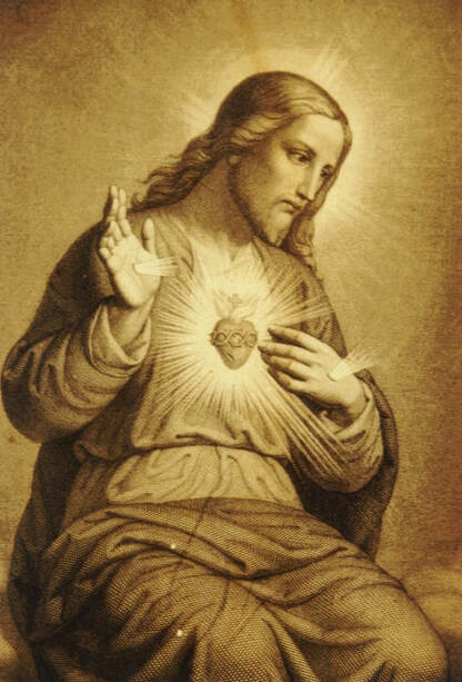 Christ hand up and other on sacred heart